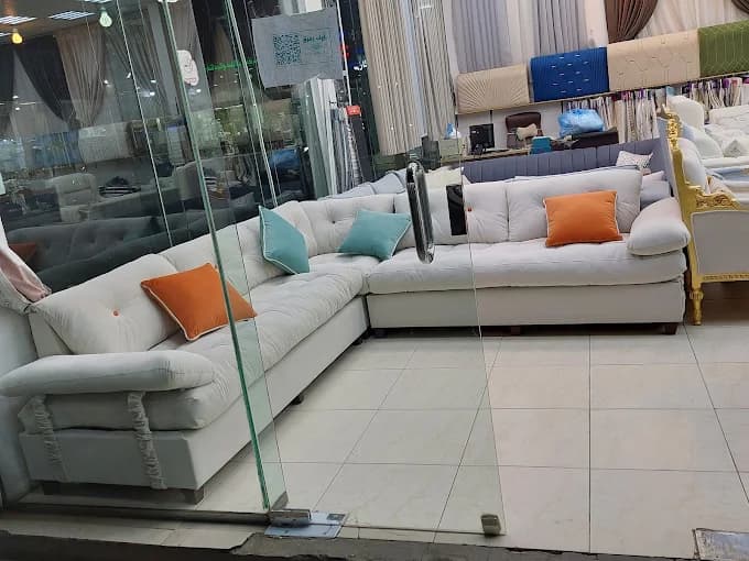 Sofas, fabric samples and curtain displays inside the ASAAR showroom